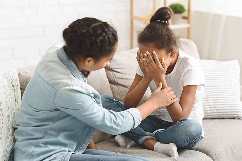 Woman comforting a scared child